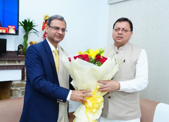 Pushkar Singh Dhami with Sanjay Malhotra